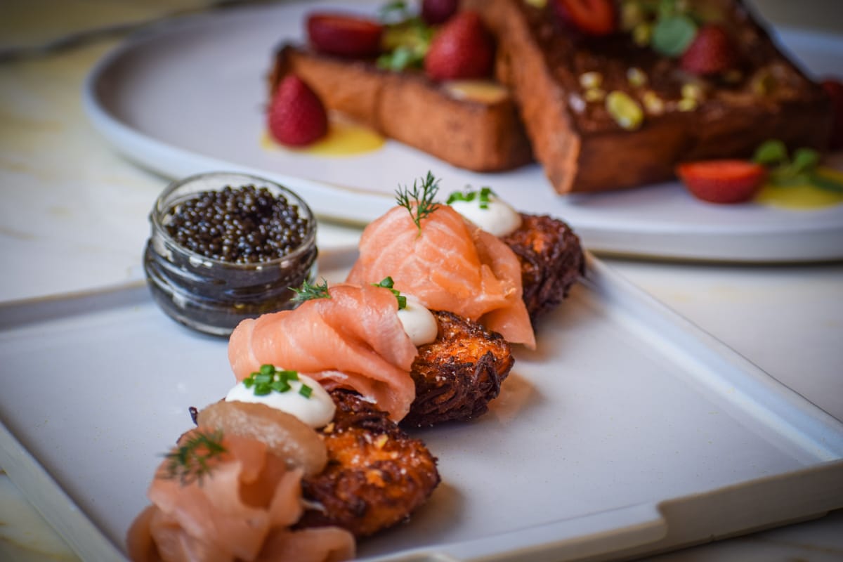Bungalow_Sweet Potato Pancakes with Tsar Nicoulai Osetra Caviar, Toasted Coconut French Toast (Photo Credit Brian Addison)