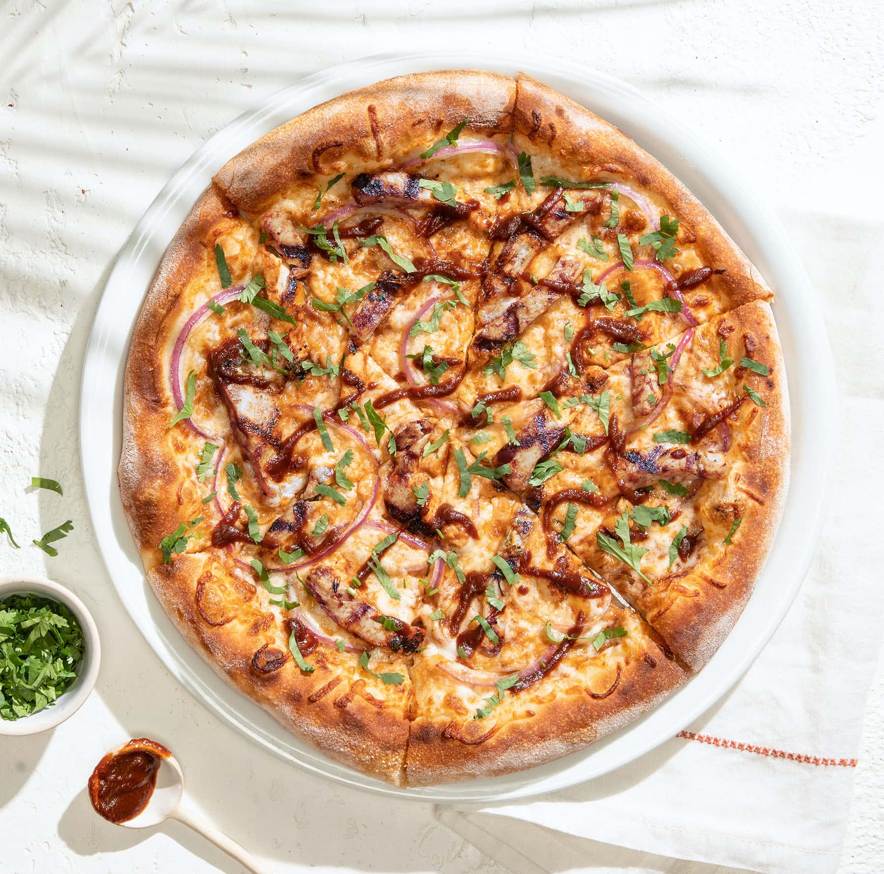 California Pizza Kitchen CPK_MenuHero_Pizza_BBQ_Chicken_HiRes (2)-min
