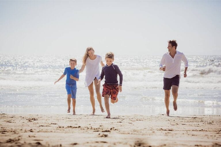 Family Running on Beach